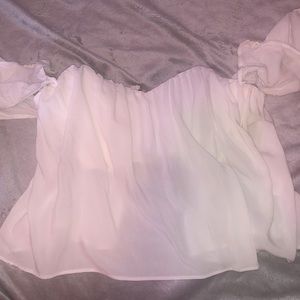 Off the shoulder, open back crop top with a zipper in the back